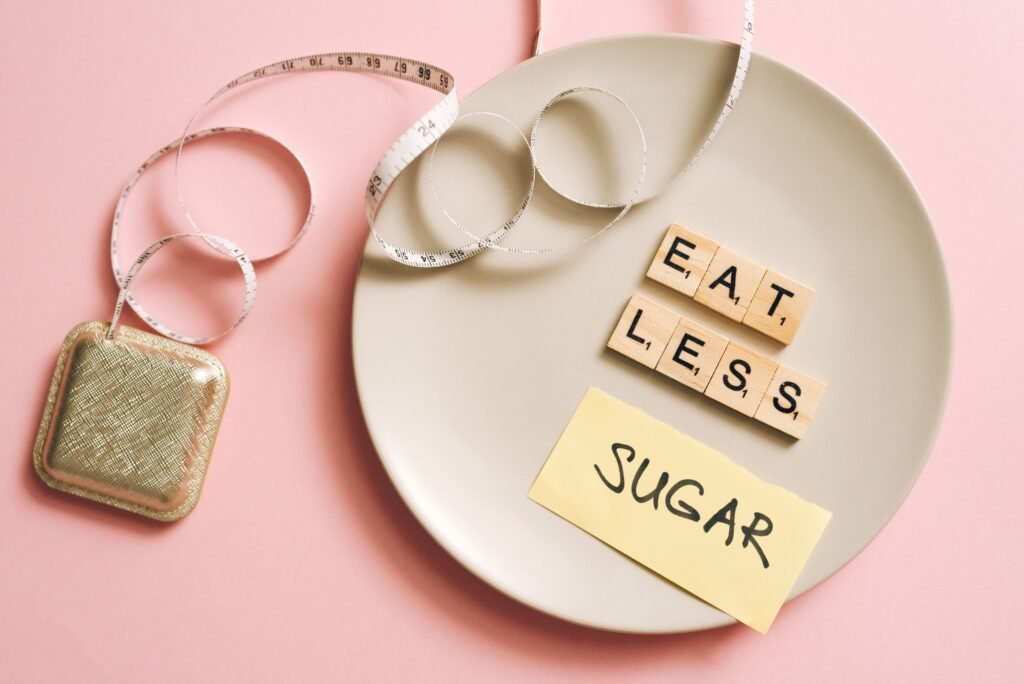 A conceptual image featuring a plate with messages made from Scrabble tiles and a tape measure, promoting healthy eating.