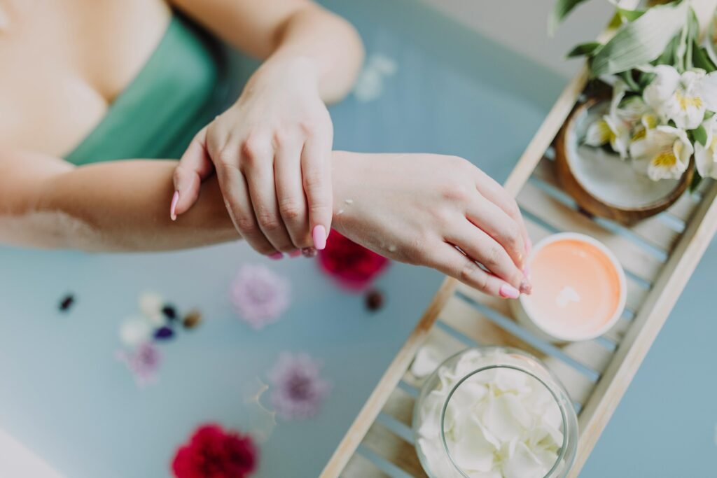 A serene spa experience with flowers, candles, and a relaxing bath. Perfect for self-care and relaxation.