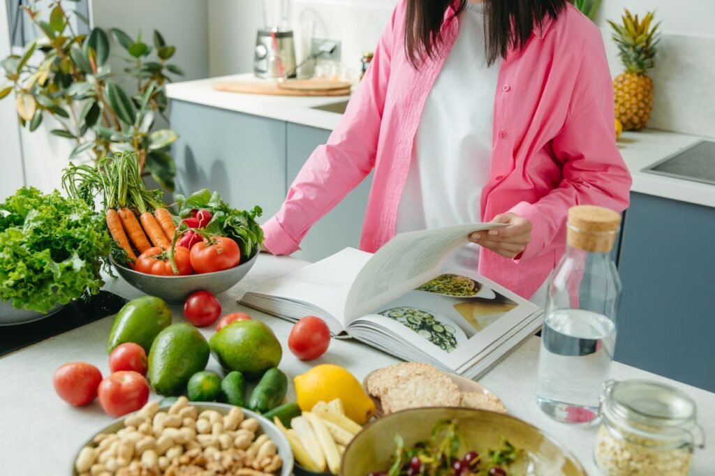 Healthy lifestyle with fresh fruits, vegetables, fitness equipment, water, and balanced meals promoting daily wellness and healthy living.